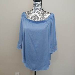 Jennifer Lopez off shoulder top